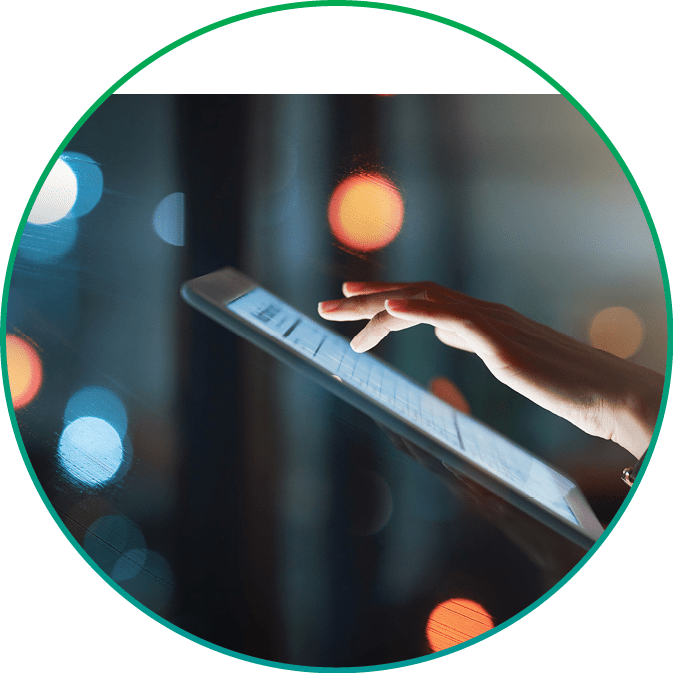 Cropped shot of an unrecognizable businesswoman using a digital tablet while working late