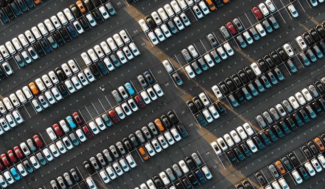 ra aerial view of the parked new cars 1158232690 featured